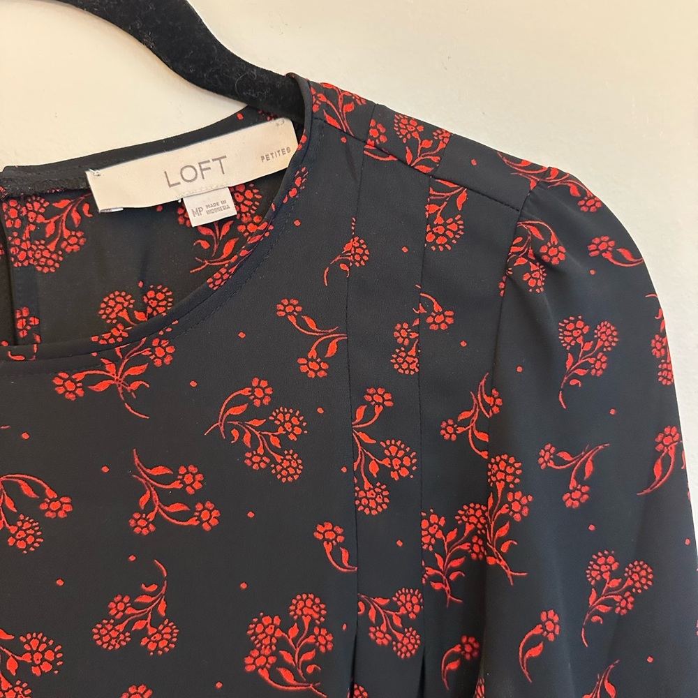 Black long sleeve blouse with red floral detail
